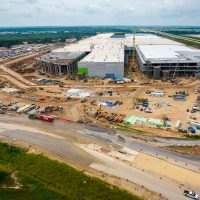 Austin , Texas , USA - August 30th 2021:  Amazing aerial drone views from above GigaTexas show the construction progress of the Factory that will make the Tesla Modlel Y qnd then the Cybertruck and maybe tesla Semi and Tesla Bot